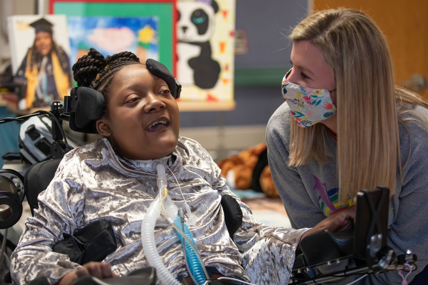 Children's of Mississippi patient DeAsia Scott shares a laugh with palliative and complex care team member RN Shannon Brown.